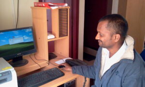 Raju, a former employee at his work station in Tonse office